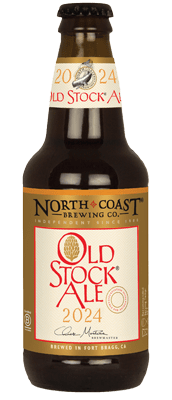 A picture of Old Stock Ale 2024 in a 12 oz bottle. The twelve ounce bottle has label with gold banner and red text spelling out the name of this ale.