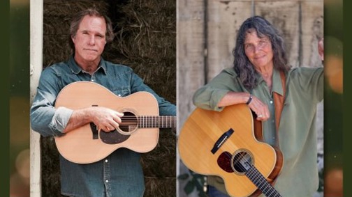 A photo of Keith Greeninger and Nina Gerber holding guitars posing for a cover photo