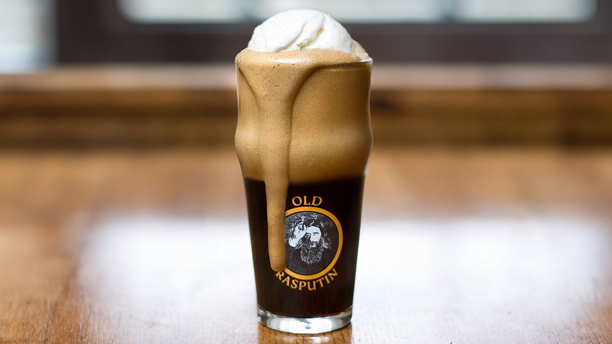 A glass of Old Rasputin Russian Imperial Stout with a scoop of ice cream in it, sitting on a countertop.