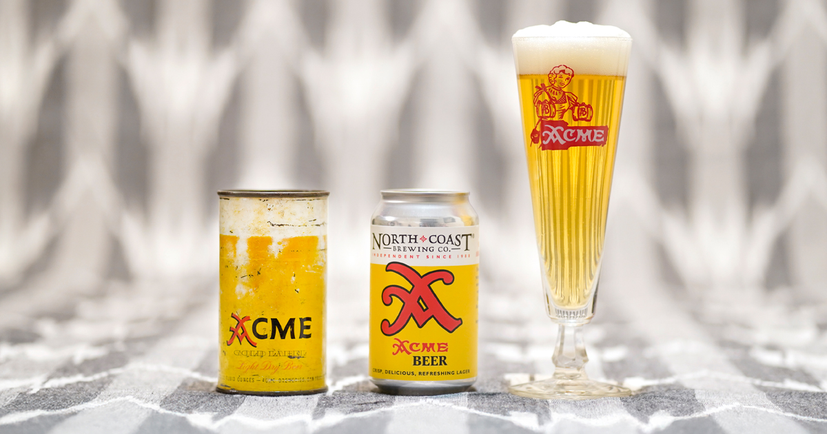 Can of North Coast Brewing Acme Beer, historical Acme Beer can, and glass of Acme beer on a neutral background.
